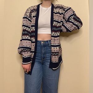 Super cute wrap around pattern expressions Worldwide sweater